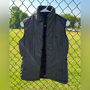 North Face black zip up vest in size large.